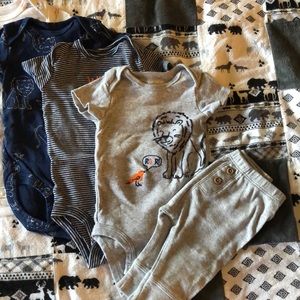 Carter’s onesies and 1 pair of pants